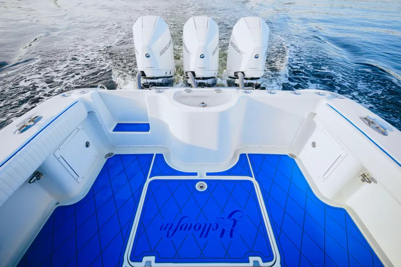  Yacht Photos Pics 2007 Yellowfin 36 Offshore boat with triple Mercury engines and blue deck flooring.