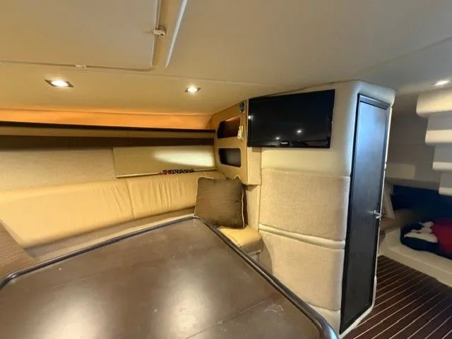  Yacht Photos Pics Interior of a 2016 Cobalt A40 yacht with sofa and TV.