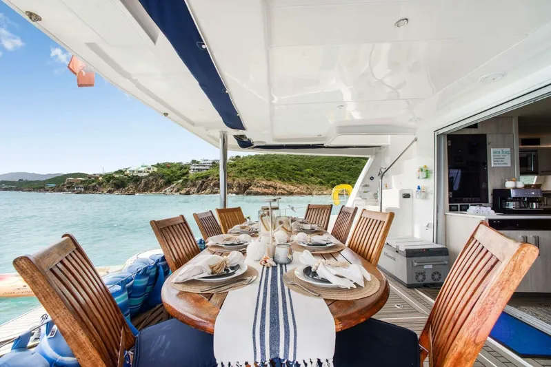 Deep Blue Yacht Photos Pics Luxurious dining setup on 2016 Leopard 58 Catamaran with ocean view.