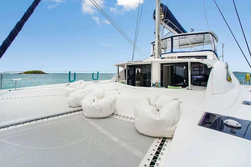 Deep Blue Yacht Photos Pics 2016 Leopard 58 Catamaran with spacious deck, bean bags, and ocean view.