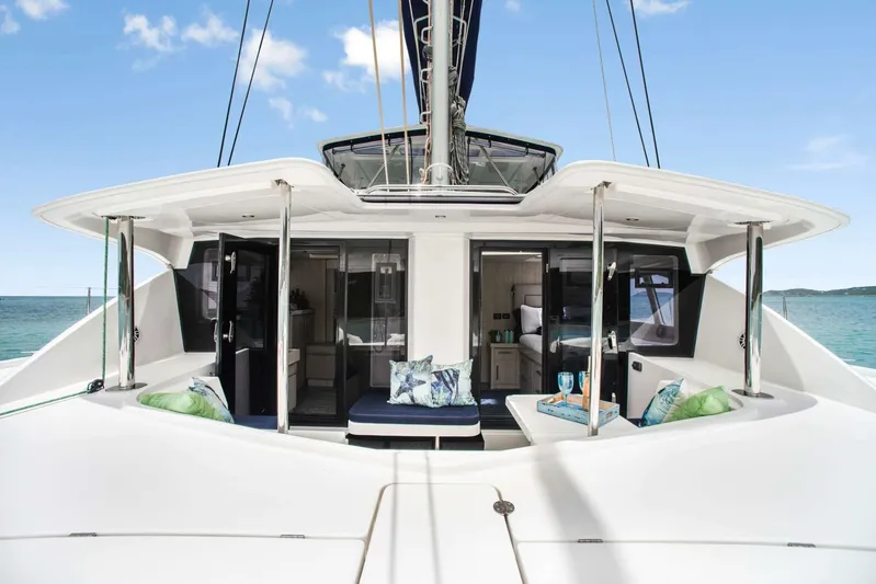 Deep Blue Yacht Photos Pics 2016 Leopard 58 Catamaran with luxurious deck, ocean view, and modern interior design.