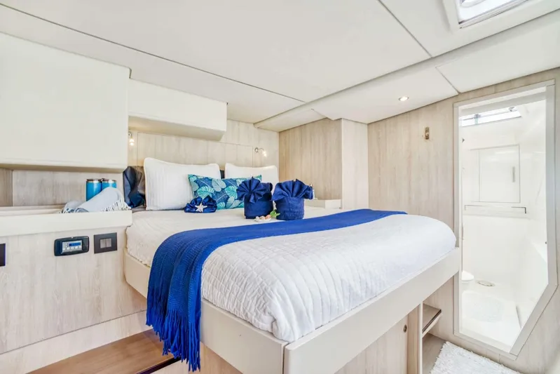 Deep Blue Yacht Photos Pics Luxurious 2016 Leopard 58 Catamaran bedroom with elegant blue accents and modern design.