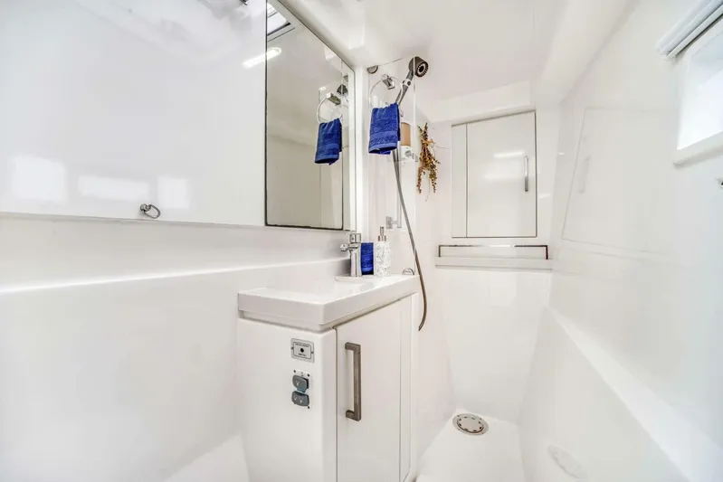 Deep Blue Yacht Photos Pics Luxurious bathroom in a 2016 Leopard 58 Catamaran, featuring modern fixtures and sleek design.