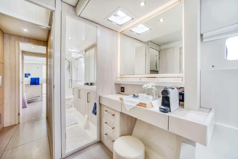 Deep Blue Yacht Photos Pics Luxurious interior of 2016 Leopard 58 Catamaran featuring modern bathroom and vanity area.