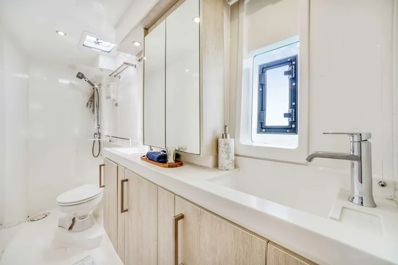 Deep Blue Yacht Photos Pics Luxurious bathroom in 2016 Leopard 58 Catamaran with modern fixtures and ample storage.