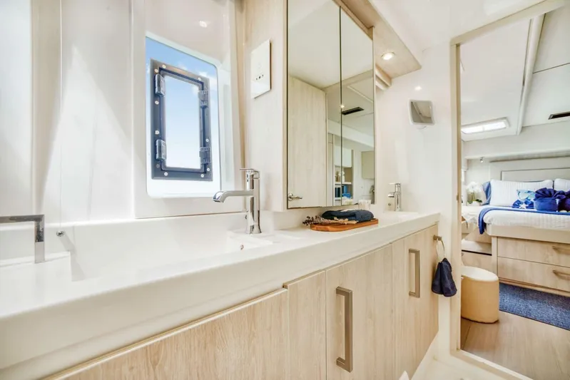 Deep Blue Yacht Photos Pics Luxurious bathroom interior of 2016 Leopard 58 Catamaran with modern fixtures and elegant design.