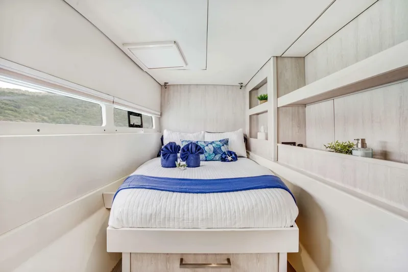 Deep Blue Yacht Photos Pics Luxurious bedroom interior of 2016 Leopard 58 Catamaran with elegant decor and natural light.