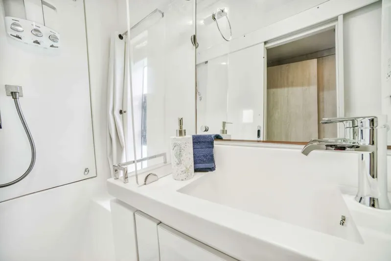 Deep Blue Yacht Photos Pics Modern bathroom in 2016 Leopard 58 Catamaran with sleek fixtures and white decor.