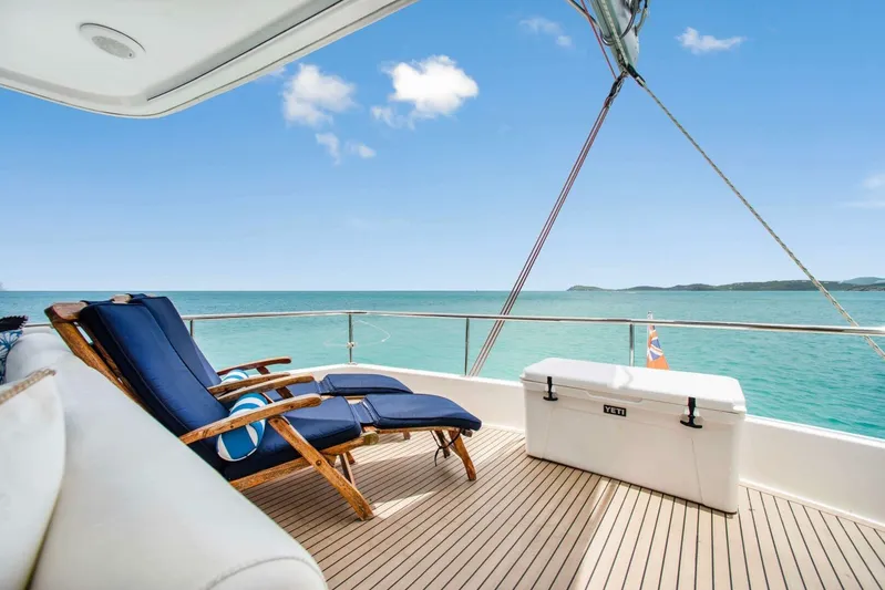 Deep Blue Yacht Photos Pics Luxury deck view on 2016 Leopard 58 Catamaran with ocean backdrop and lounge chairs.
