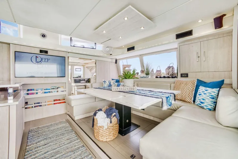 Deep Blue Yacht Photos Pics Luxurious interior of 2016 Leopard 58 Catamaran with modern decor and comfortable seating.