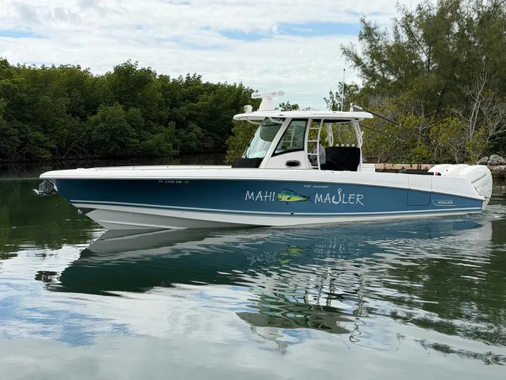  Yacht Photos Pics 2019 Boston Whaler 350 Outrage boat on calm water.