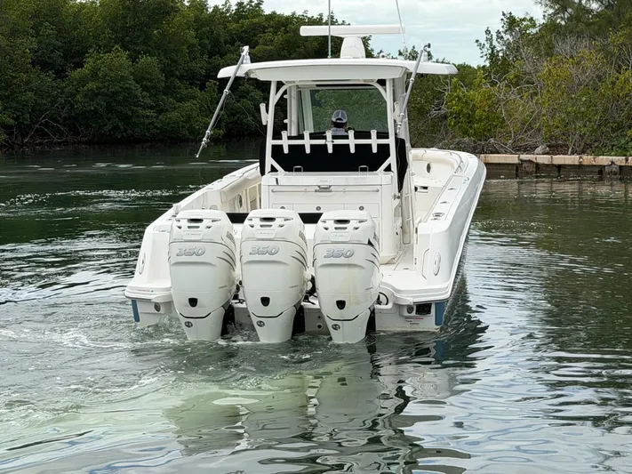  Yacht Photos Pics Boston Whaler 350 Outrage 2019 with triple engines on calm water.