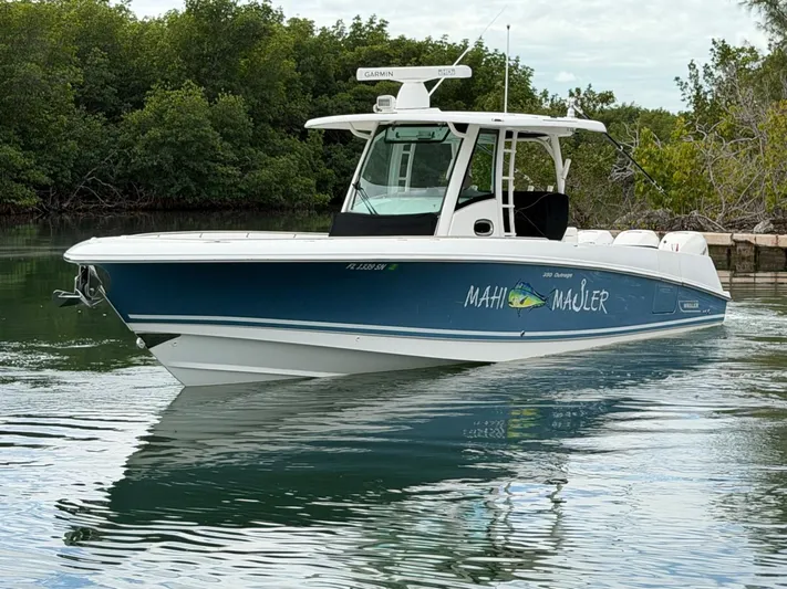  Yacht Photos Pics 2019 Boston Whaler 350 Outrage boat on calm water.