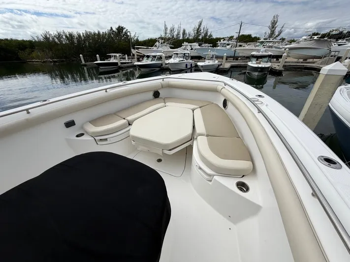  Yacht Photos Pics 2019 Boston Whaler 350 Outrage with beige seating area in harbor.