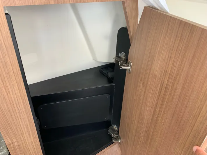  Yacht Photos Pics Interior of a 2019 Boston Whaler 350 Outrage with open wooden door.