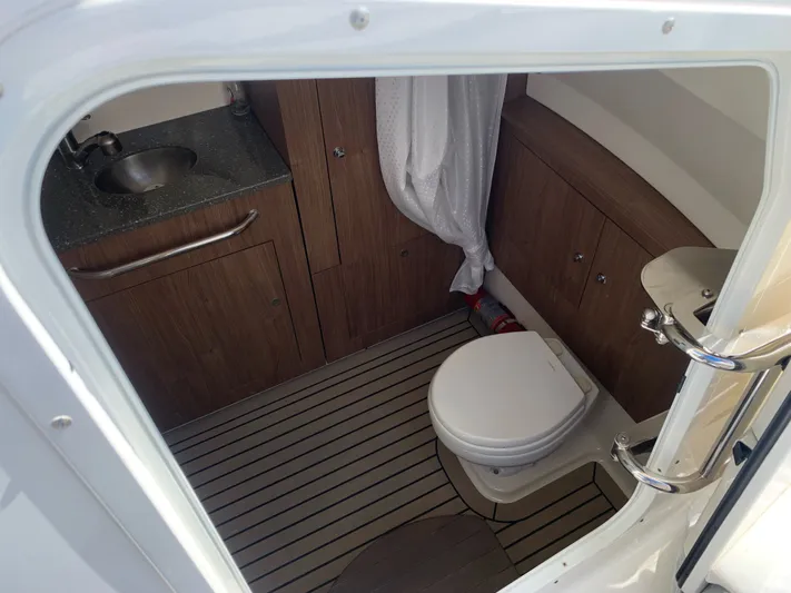  Yacht Photos Pics Interior of 2019 Boston Whaler 350 Outrage with toilet and sink.