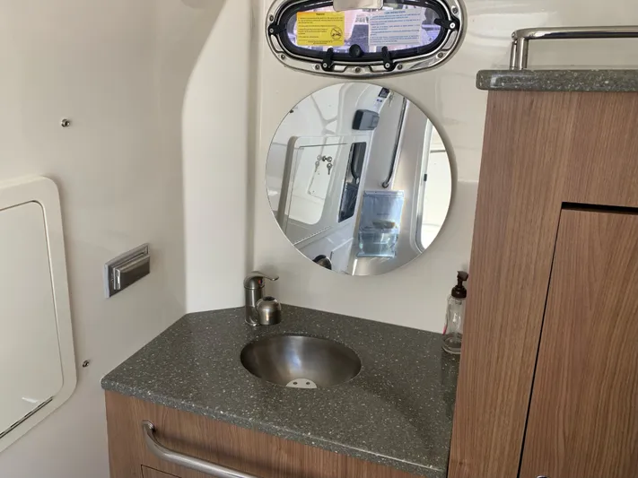  Yacht Photos Pics Interior of 2019 Boston Whaler 350 Outrage with sink and mirror.