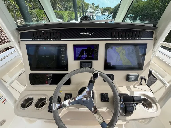  Yacht Photos Pics 2019 Boston Whaler 350 Outrage helm with navigation systems.