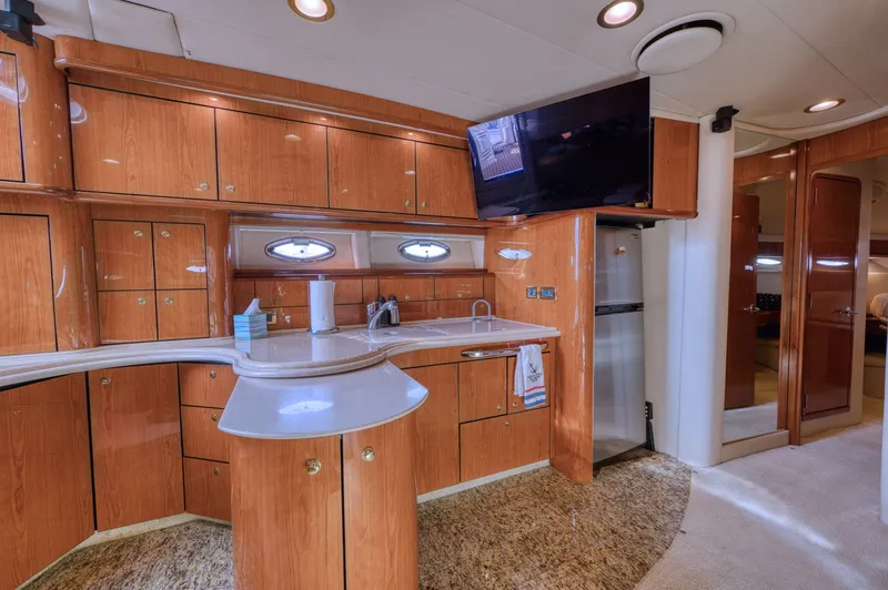 Couples Therapy Yacht Photos Pics Luxurious 2001 Sea Ray 510 Sundancer yacht interior with modern kitchen and sleek wood cabinetry.
