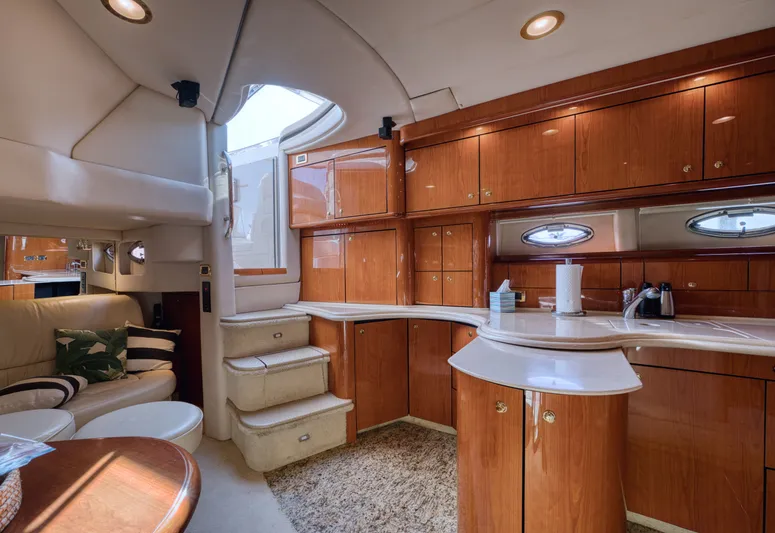 Couples Therapy Yacht Photos Pics Luxurious interior of 2001 Sea Ray 510 Sundancer yacht with elegant wood cabinetry.