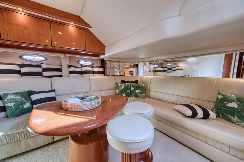 Couples Therapy Yacht Photos Pics Luxurious interior of 2001 Sea Ray 510 Sundancer yacht with plush seating and elegant decor.