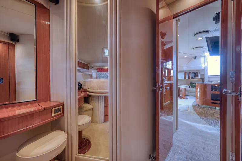 Couples Therapy Yacht Photos Pics Luxurious interior of 2001 Sea Ray 510 Sundancer yacht, featuring elegant wood finishes and cozy seating.