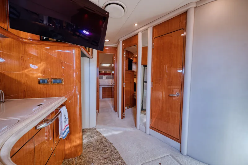 Couples Therapy Yacht Photos Pics Luxurious interior of 2001 Sea Ray 510 Sundancer yacht with wood finishes and modern amenities.