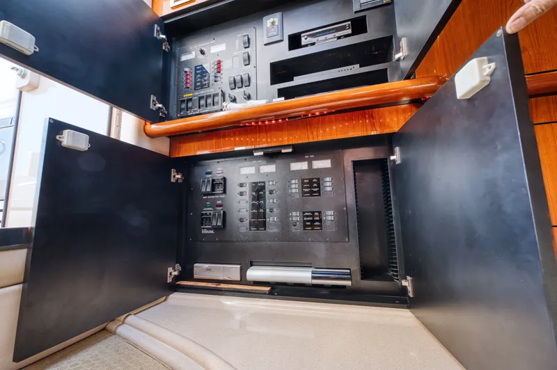 Couples Therapy Yacht Photos Pics Electrical panel inside a 2001 Sea Ray 510 Sundancer yacht, showcasing control switches.
