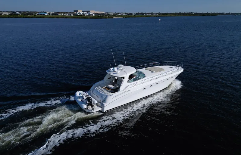 Couples Therapy Yacht Photos Pics 2001 Sea Ray 510 Sundancer yacht cruising on open water, aerial view.