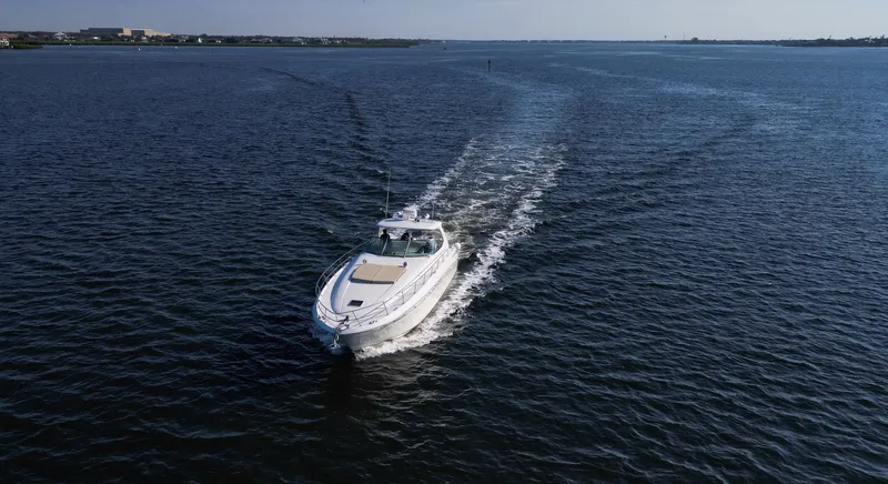 Couples Therapy Yacht Photos Pics 2001 Sea Ray 510 Sundancer cruising on open water, aerial view.
