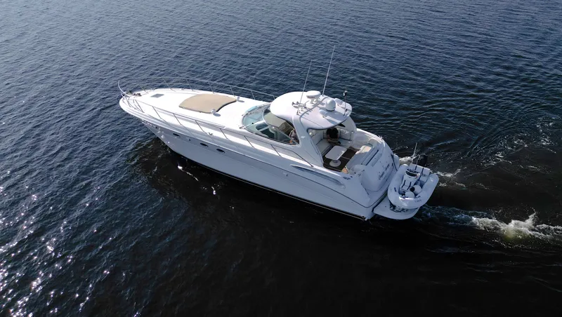 Couples Therapy Yacht Photos Pics 2001 Sea Ray 510 Sundancer yacht cruising on open water, aerial view.