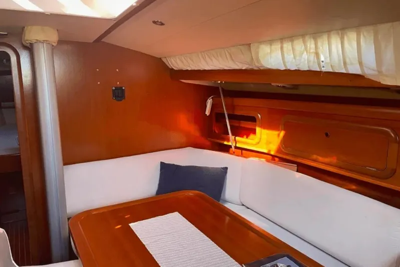  Yacht Photos Pics Interior of 2003 Cantiere del Pardo Grand Soleil 43 yacht with cozy seating area.