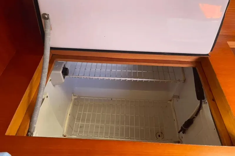  Yacht Photos Pics Open storage compartment in 2003 Cantiere del Pardo Grand Soleil 43 yacht interior.