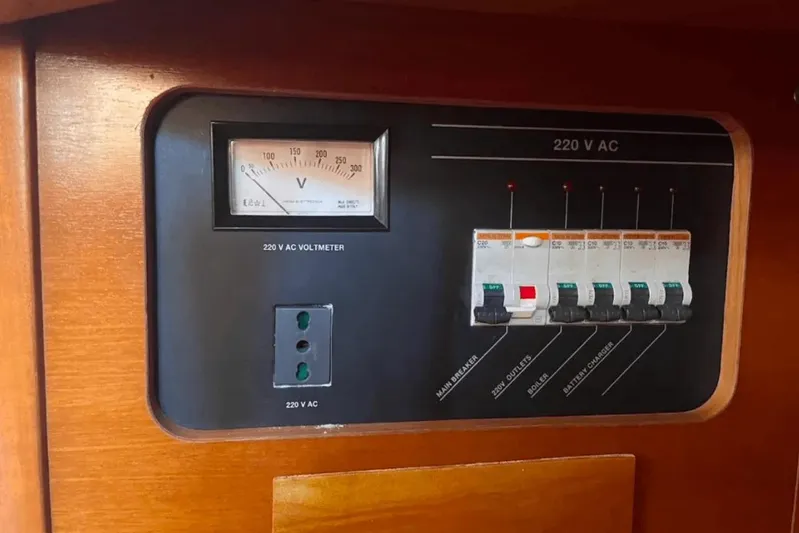 Yacht Photos Pics Electrical panel of 2003 Cantiere del Pardo Grand Soleil 43 yacht, featuring voltmeter and circuit breakers.