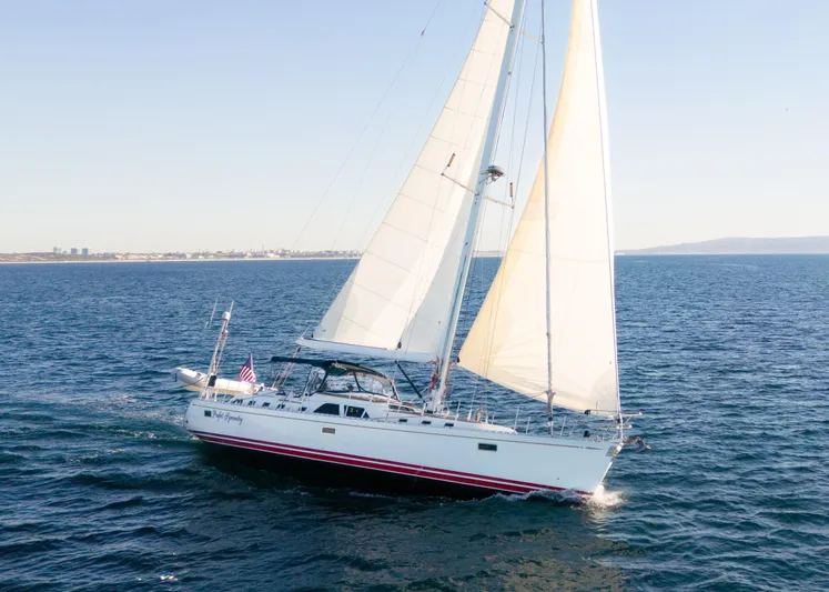 Perfect Symmetry Yacht Photos Pics Sailing yacht Hylas 70, 2006 model, cruising on open sea with full sails.