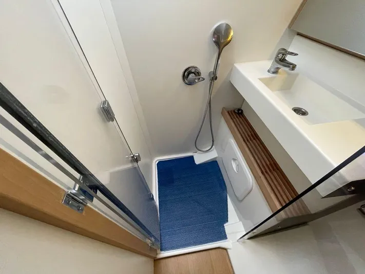  Yacht Photos Pics Bathroom of 2020 Jeanneau Sun Odyssey 440 yacht with shower and sink.