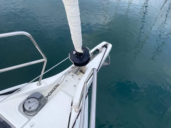  Yacht Photos Pics Jeanneau Sun Odyssey 440 bow detail, 2020 model, anchored on calm water.