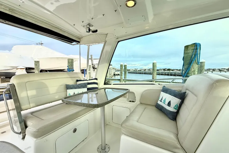  Yacht Photos Pics Luxurious interior of 2014 Boston Whaler 345 Conquest Pilothouse with waterfront view.
