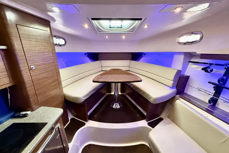  Yacht Photos Pics Interior of 2014 Boston Whaler 345 Conquest Pilothouse with elegant seating and ambient lighting.