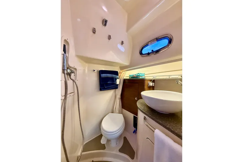  Yacht Photos Pics 2014 Boston Whaler 345 Conquest Pilothouse bathroom with shower, toilet, and sink.