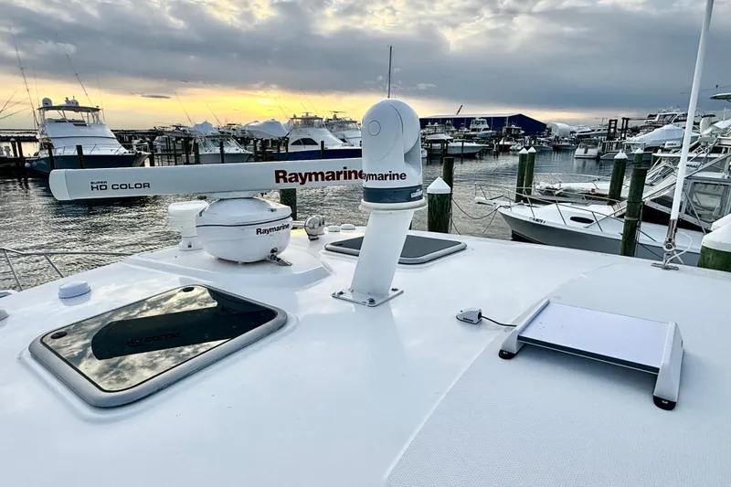  Yacht Photos Pics Boston Whaler 345 Conquest Pilothouse 2014 with Raymarine equipment at marina during sunset.