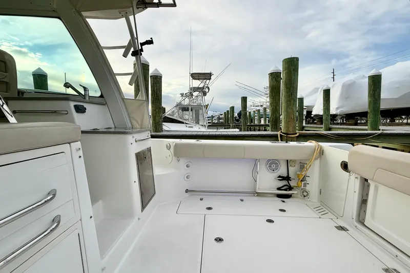  Yacht Photos Pics 2014 Boston Whaler 345 Conquest Pilothouse interior view at marina dock.