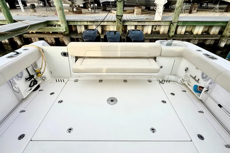  Yacht Photos Pics 2014 Boston Whaler 345 Conquest Pilothouse boat deck with seating and storage.