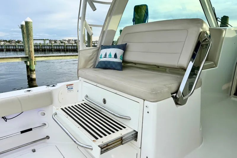  Yacht Photos Pics 2014 Boston Whaler 345 Conquest Pilothouse seating area with nautical pillow.