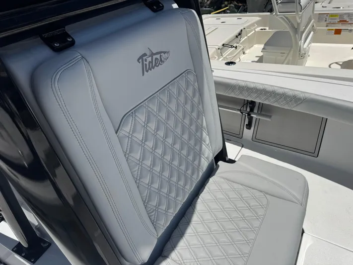  Yacht Photos Pics 2024 Tides 26 boat seat with diamond stitching and logo detail.