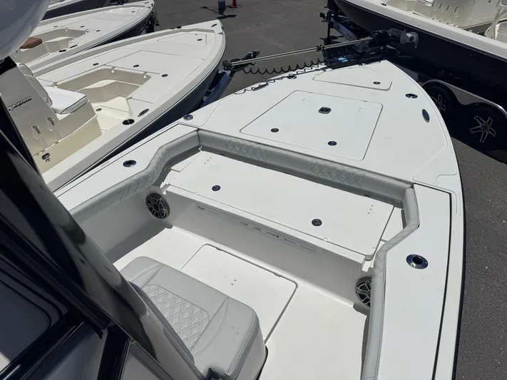  Yacht Photos Pics 2024 Tides 26 boat interior with seating and storage compartments.