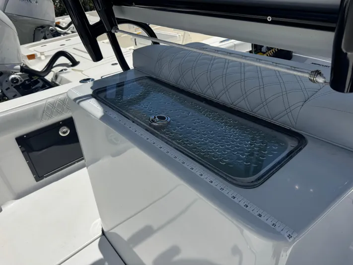  Yacht Photos Pics 2024 Tides 26 boat interior with livewell and measuring ruler.