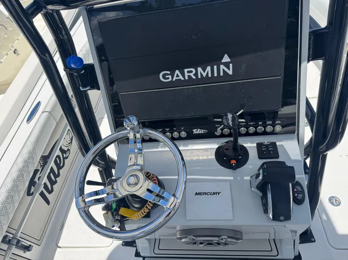  Yacht Photos Pics 2024 Tides 26 boat dashboard with Garmin display and Mercury controls.