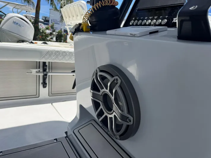  Yacht Photos Pics 2024 Tides 26 boat interior with speaker and control panel.