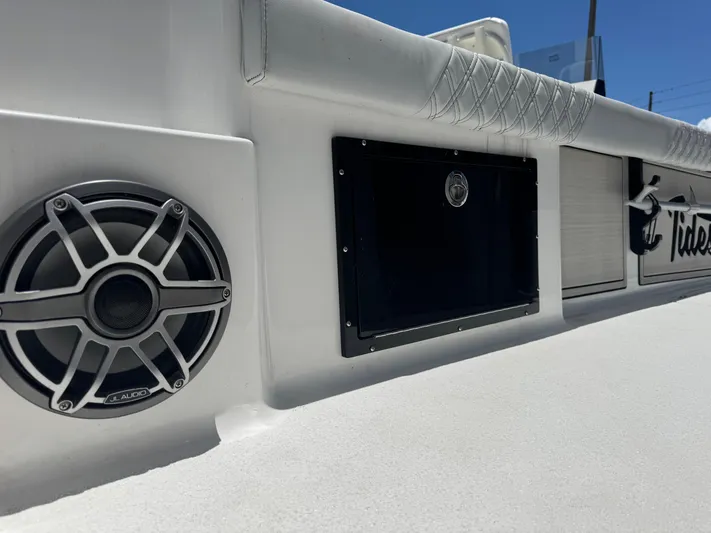 Yacht Photos Pics 2024 Tides 26 boat interior with speaker and storage compartments.